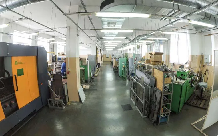 Machine shop: rows of machine tools along a central aisle